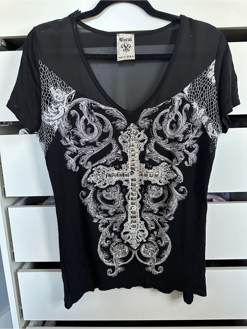 Vocal Black Short-Sleeve V-Neck Top with Silver Cross Embellishment.